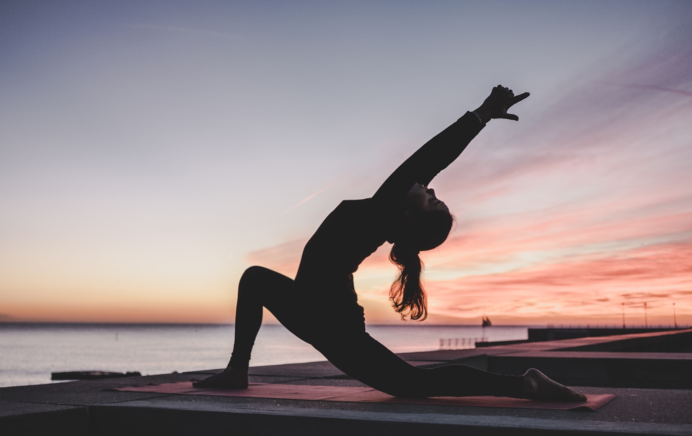 Group wellbeing practice in a bright studio overlooking nature